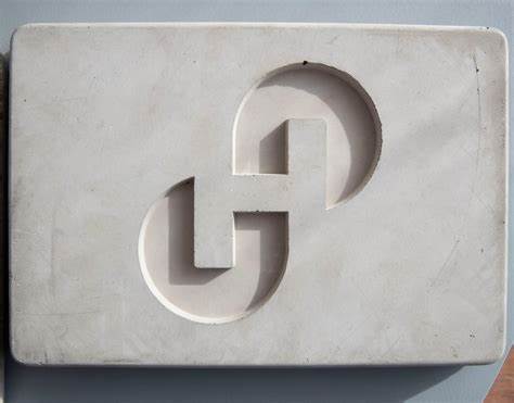Holcim shareholders approve spinoff, grumble over chairman's pay