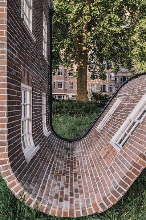 A Rippling Townhouse Facade by Alex Chinneck Takes a Seat in a London Square