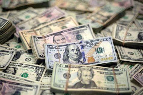 Dollar flat in choppy trading as investors await tariff certainty - Reuters