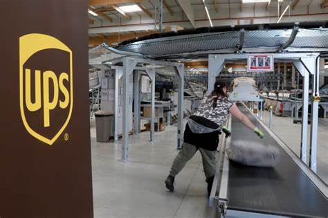 UPS profit beats estimates, to cut 20,000 jobs on economic worries