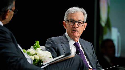 Fed warns of rising inflation, unemployment risks; holds rates steady