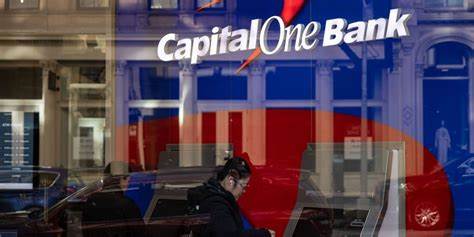 Warren prods DOJ to sue to block Capital One-Discover deal