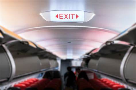 Is the airliner seat next to the emergency door the safest?