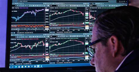 Wall Street ticks closer to its record after Oracle rallies