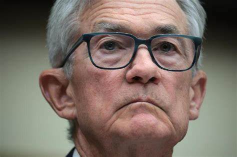 Fed Sees Lower Growth and Higher Inflation Ahead, Holds Steady on Rates