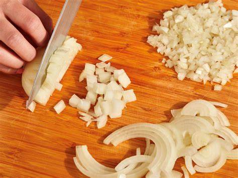 Droplet Outbursts from Onion Cutting