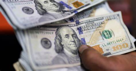 Dollar retains strength against peers after Fed rate decision