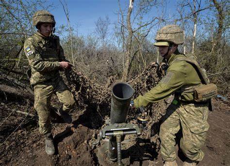 Ukraine prolongs martial law amid Russian air attacks, heavy ground battles