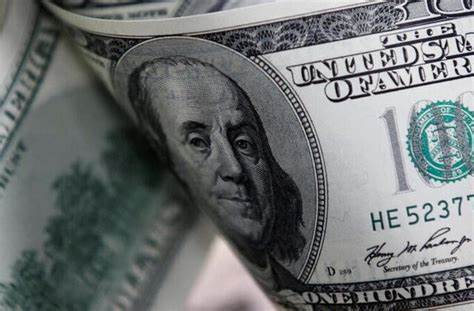 Dollar edges lower but poised for weekly gain as early rate cut hopes dim - Reuters