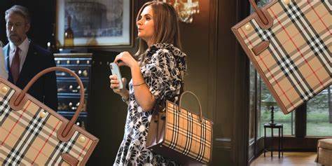 Burberry Sheds Jobs, Handbag Bling as CEO Returns to Roots