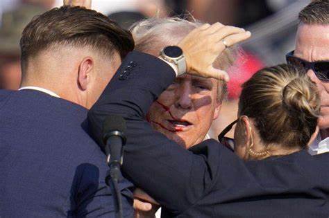 Man suspected in apparent assassination attempt on Trump charged with federal gun crimes