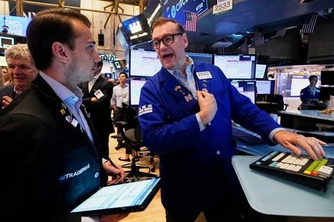 Wall Street gains ground following a solid jobs report and marks another winning week