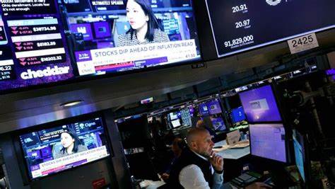 Wall St mixed in start to busy week for earnings, data